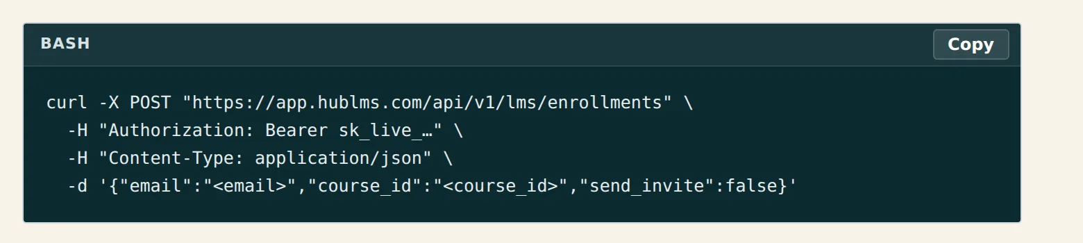 The developer reference's generated curl for creating an enrollment, with a copy button above it.